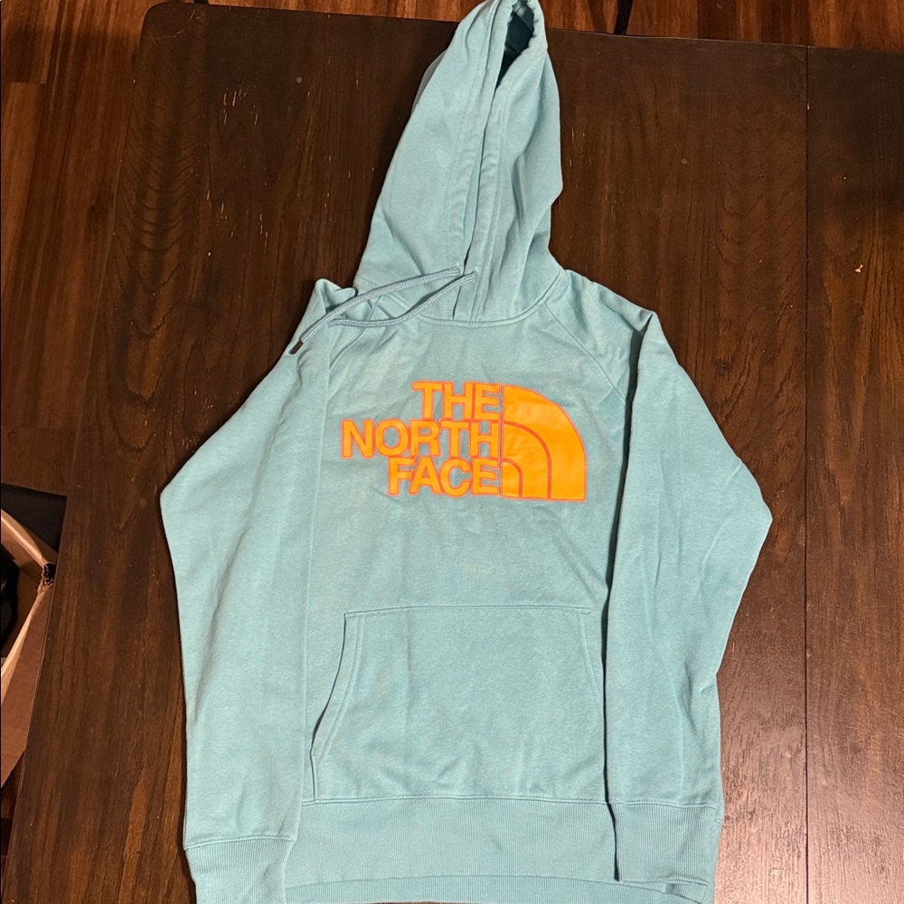 The North Face Teal Hoodie with Vibrant Orange Logo